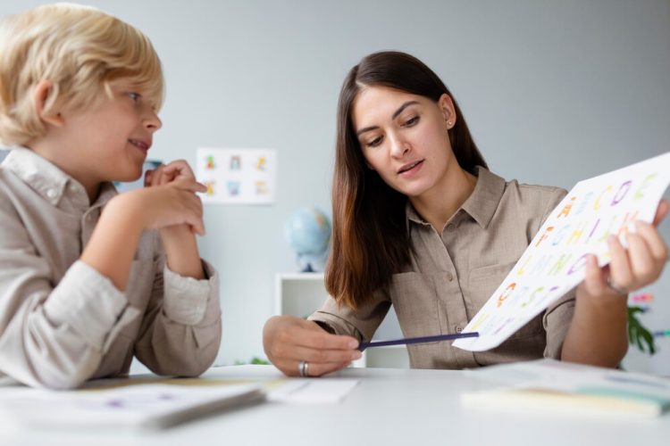 woman-doing-speech-therapy-with-little-blonde-boy_23-2149110235